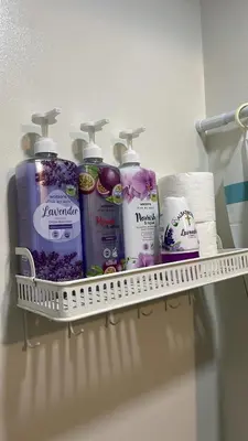 a shelf with toiletries on it in a bathroom at SPRING RESIDENCES - 2BR Condo near Airport with balcony and pool views in Manila