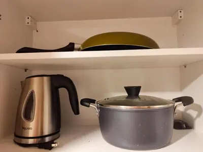 a pot sitting on top of a stove in a kitchen at Angelica Staycation at Mall of Asia Shell Residence in Manila