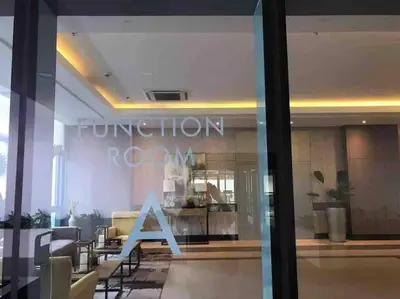 a reflection of a store window with the word function room at Studio at viceroy 4 Taguig in Manila