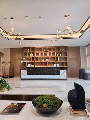 a lobby with a table with a bowl of plants at Pet & WFH Friendly Home Near BGC in Manila