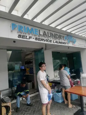 a group of people standing outside of a store at High-end 2BR Condo Boracay Tower - Azure Residences near Manila Airport in Manila
