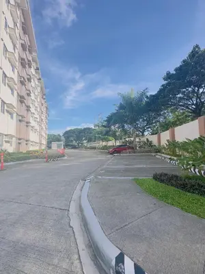 an empty street in front of a building at Zenrise Staycation in Trece Martires