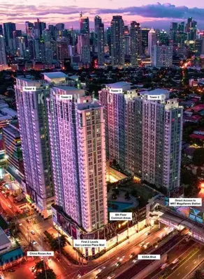 a city at night with a lot of tall buildings at Spacious 2BR Condo San Lorenzo Place 4KM Airport in Manila