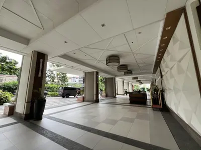 an empty lobby of a building with a large ceiling at West Bricks in Manila