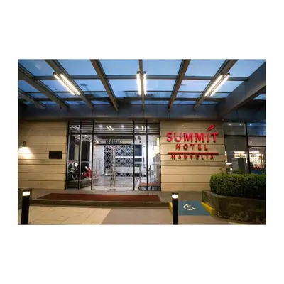 a building with a sign that reads summit hotel at Summit Hotel Magnolia in Manila