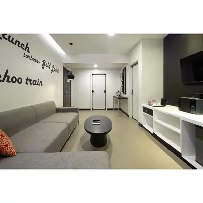 a living room with a couch and a table at Summit Hotel Magnolia in Manila