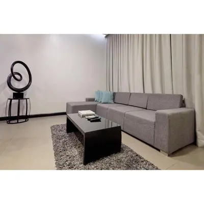 a living room with a couch and a coffee table at Summit Hotel Magnolia in Manila
