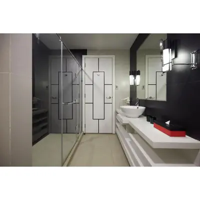 a bathroom with a glass shower and a sink at Summit Hotel Magnolia in Manila