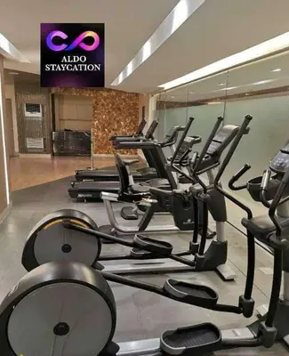 a gym with a bunch of cardio machines at Mall of Asia Pasay Shore 3 tower 2 Residences in Manila