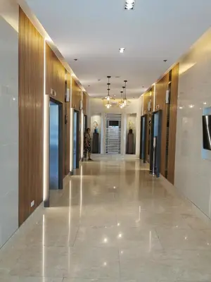 a hallway of a building with wooden walls and a long corridor at Mall of Asia Pasay Shore 3 tower 2 Residences in Manila