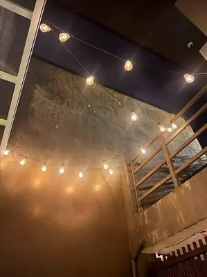 a group of lights on a ceiling with a stage at Modern minimalist house in the heart of Antipolo in Antipolo