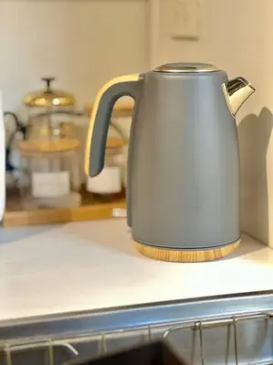 a tea kettle sitting on top of a kitchen counter at Modern minimalist house in the heart of Antipolo in Antipolo