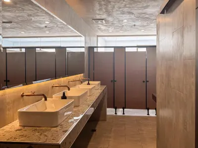 a row of sinks in a public bathroom at Yamato Hostel in Manila