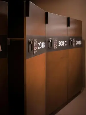 two metal elevator doors with numbers on them at Yamato Hostel in Manila