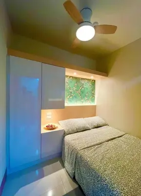 a bedroom with two beds and a ceiling fan at Cozy and aesthetic unit near MOA Airport and IKEA in Manila