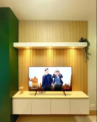 a flat screen tv sitting on top of a cabinet at Cozy and aesthetic unit near MOA Airport and IKEA in Manila
