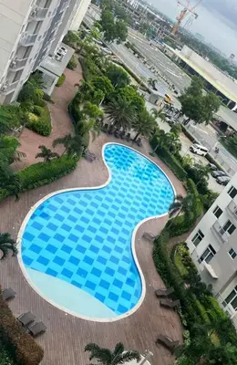 an overhead view of a swimming pool in a building at south residences in Manila