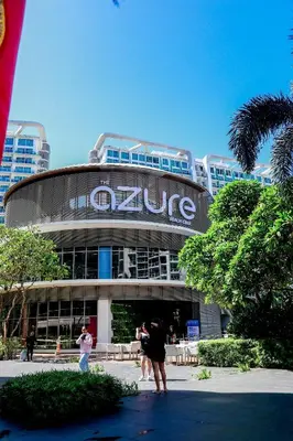 a group of people standing in front of a building at Azure Urban Resort Staycation 1 Bedroom Beach View, 18th floor in Manila