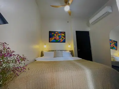 a bedroom with a large bed and a ceiling fan at Executive luxury 2BR Condo Unit in McKinley Hill BGC Taguig in Manila