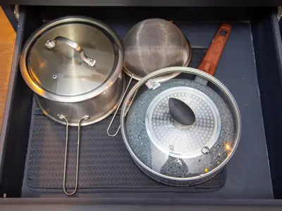 a tray with pots and pans and a spoon at Azure Urban Resort Staycation 1Bedroom with PS4, 3rd floor in Manila
