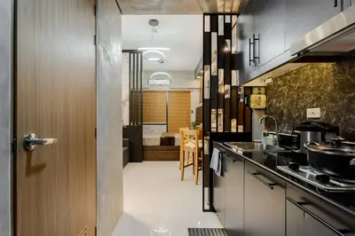 a kitchen with a sink and a door to a room at 1BR Makati, Lush Residences M004 in Manila