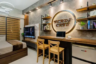 a bedroom with a bed and a desk with a computer at 1BR Makati, Lush Residences M004 in Manila
