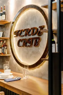 a sign on the wall of a bar with wine bottles at 1BR Makati, Lush Residences M004 in Manila