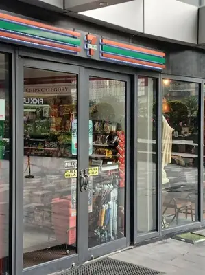 a store front with glass doors on a street at Spacious 1BR Milano by Versace in Makati in Manila