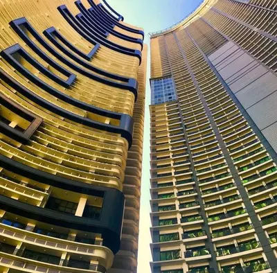 two tall buildings standing next to each other at Spacious 1BR Milano by Versace in Makati in Manila