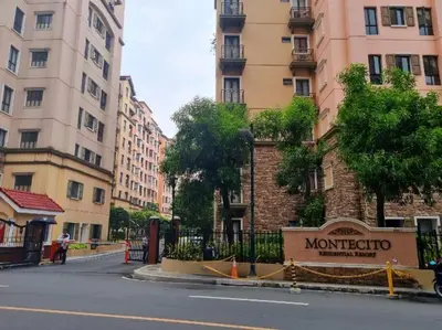 a street with a sign in front of some buildings at 1-Bedroom condo with pool across NAIA Terminal 3 in Manila