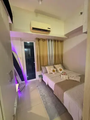 Gallery image of Cozy 1BR Netflix & Alexa w Balcony Free Pool in Manila