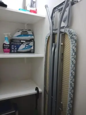 a refrigerator on a shelf in a closet at Modern 1BD in Ortigas, WiFi ,Netflix ,Pool ,Gym in Manila