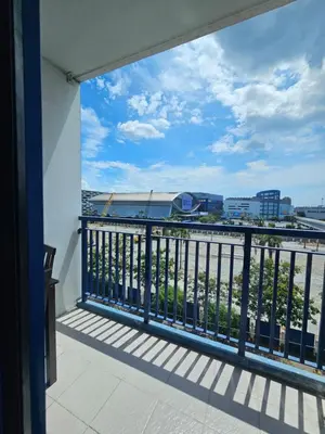 a balcony with a view of the city at Moa Staycation at Sea Residences Mingchie place in Manila
