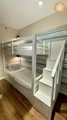 a couple of bunk beds in a room at Kize Staycation in Manila