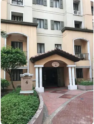 a large building with a door in front of it at Montecito unit near airport in Manila