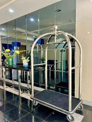 a barber shop with a table and a mirror at Glade Suite in Trece Martires