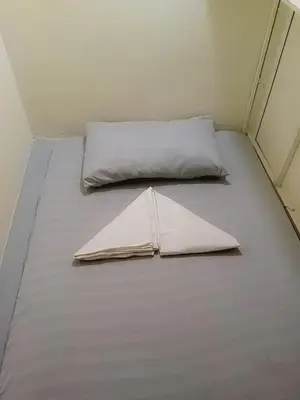 a bed in a room with two pillows on it at RDC- Baclaran Transient Capsule in Manila