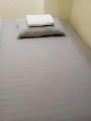 a large white bed in a room at RDC- Baclaran Transient Capsule in Manila
