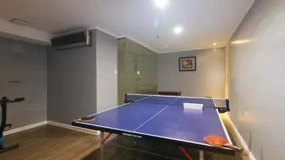 a ping pong table in a room with a ping pong ball at RedDoorz Premium at JjimJBang Hotel Spa in Manila