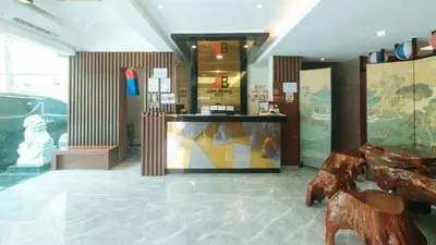 a store with a store front with a bench in a room at RedDoorz Premium at JjimJBang Hotel Spa in Manila