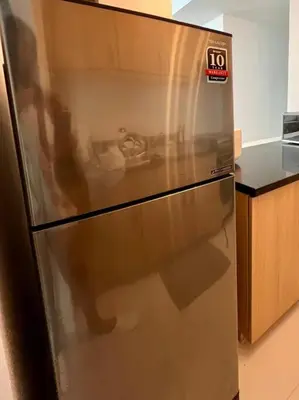 a stainless steel refrigerator in a kitchen at Charming 3-BR Condo in BGC in Manila