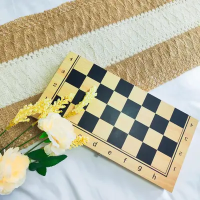 a ruler sitting on top of a table with flowers at Paradise Realm Condotel in Manila