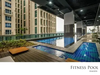 a swimming pool in the middle of a building at The Oasis 1 BR with Pool Sauna Gym and More in Manila