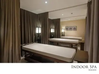 a hospital room with two beds and a mirror at The Sweet Escape 1 BR w Pool, Sauna, Gym and More in Manila