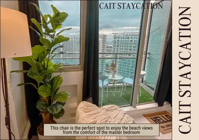 a magazine cover of a balcony with a view of a city at Azure Parañaque - 2br Beach View 18th Floor in Manila
