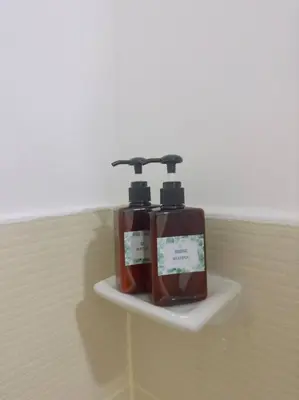 two bottles ofodorizers on a shelf on a wall at Zenrise Staycation Condo in SMDC Hope Residences Trece Martires in San Agustin
