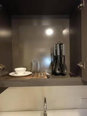 a kitchen with a counter with a coffee maker at GBA Condotel at Bonifacio Civic Center Tower in Manila