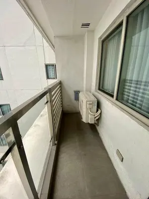 a bathroom with a toilet in a building at GBA Condotel at Bonifacio Civic Center Tower in Manila