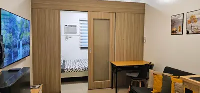 a room with a door leading to a bedroom at Q Workcation WFH Staycation in Manila