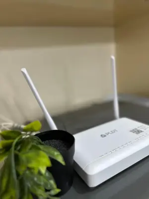 a plant sitting next to a device on a table at COZI Venice Luxury Residences Alessandro BGC w Pool Gym in Manila